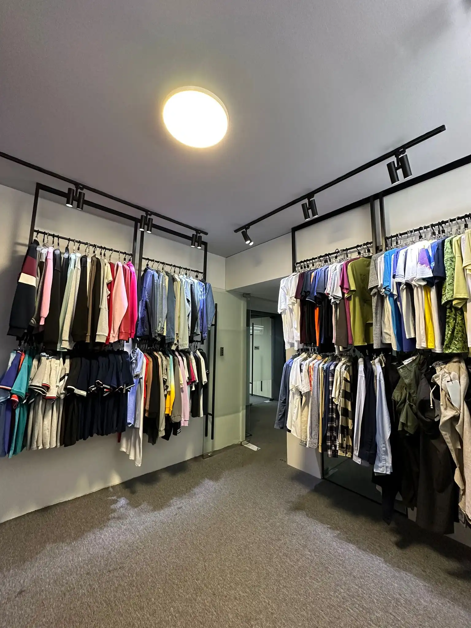 Showroom wall with colourful garment samples